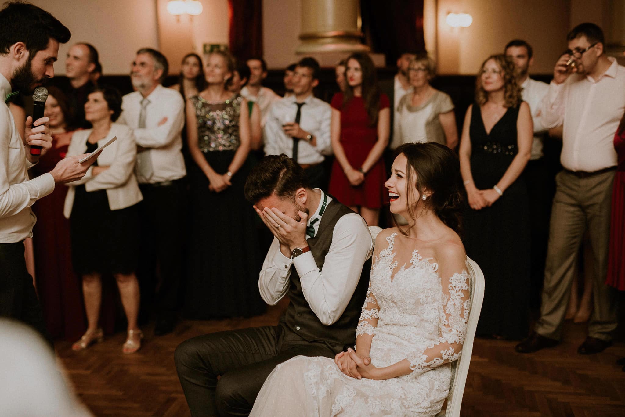 bride and groom get embarrased during a wedding game