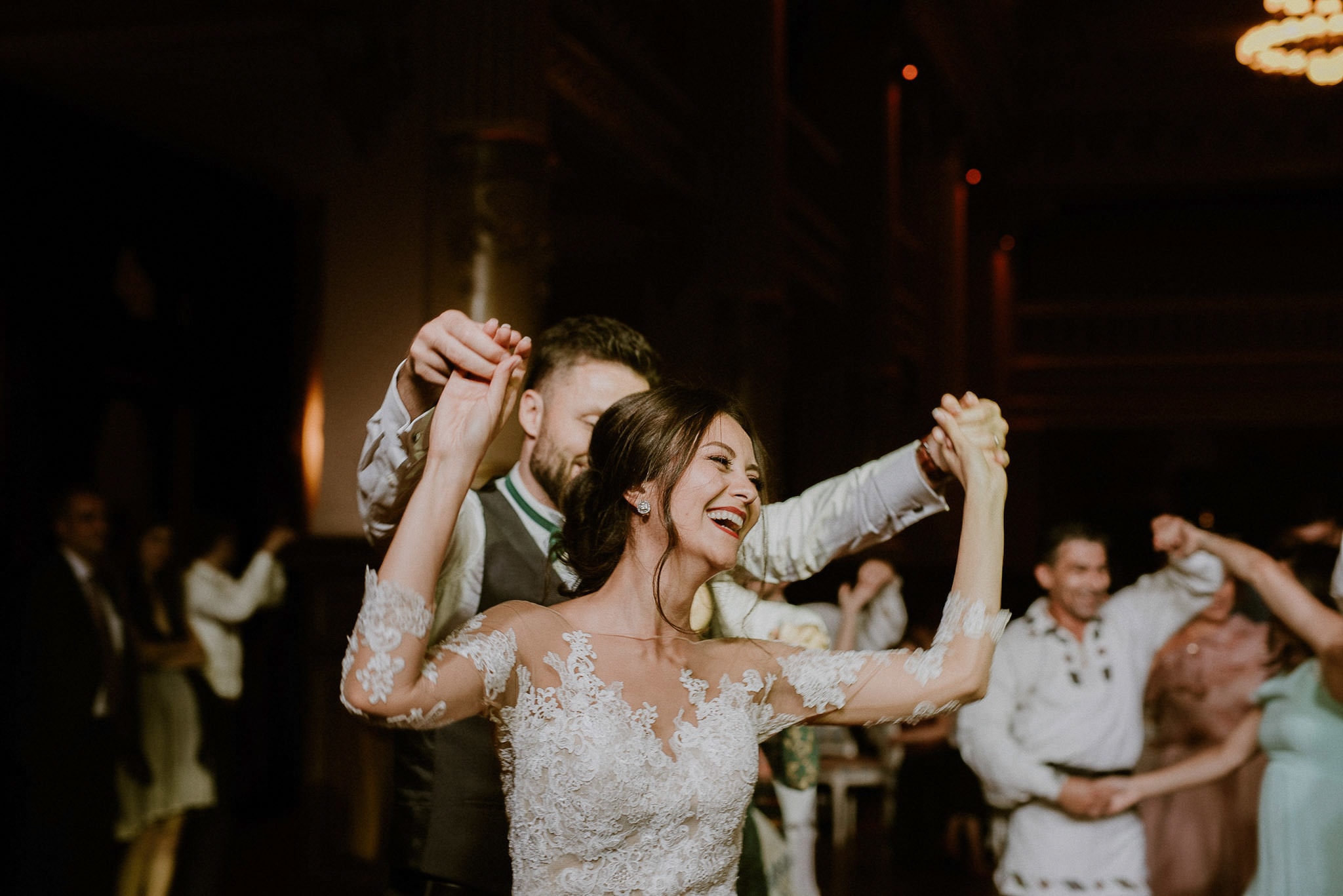 happy bride dancing together with her husband
