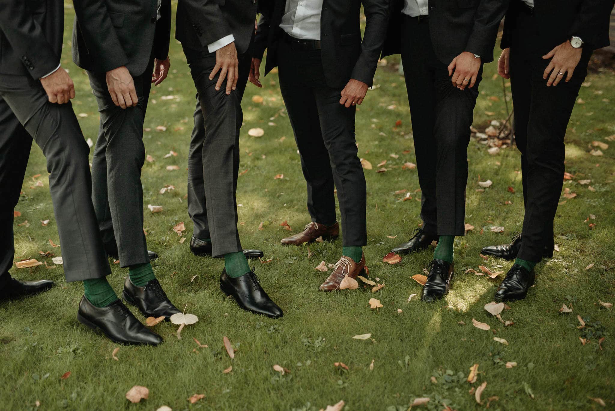 groom and his men show matching green socks