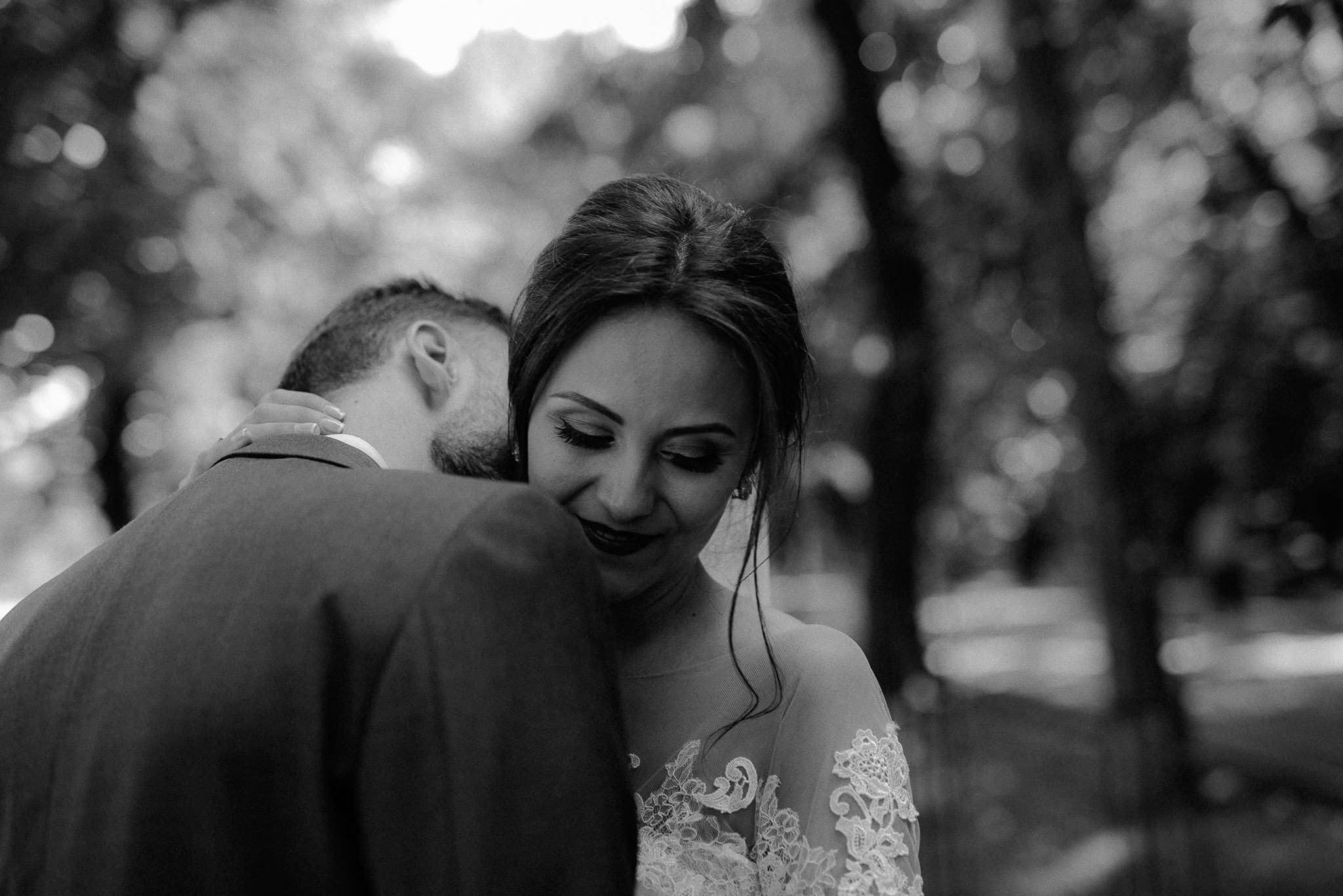 groom kissing his bride's neck in a tender moment