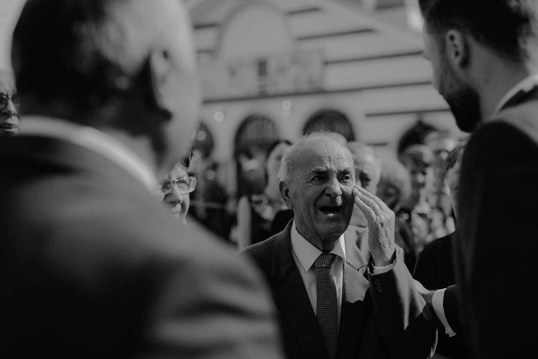 bride's grandfather getting emotional when he first sees her arriving to the church