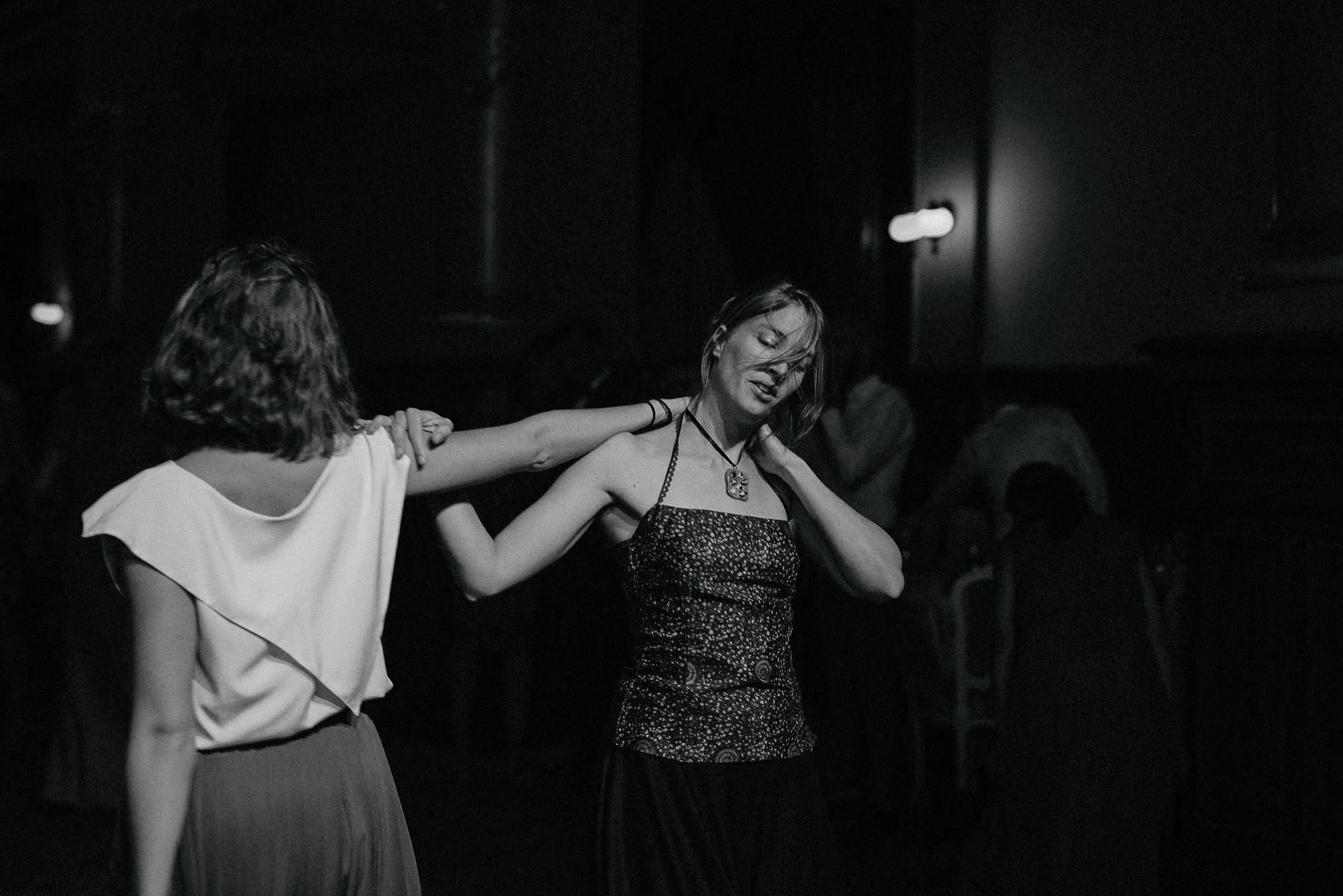 a female couple dancing together close to the end of the wedding