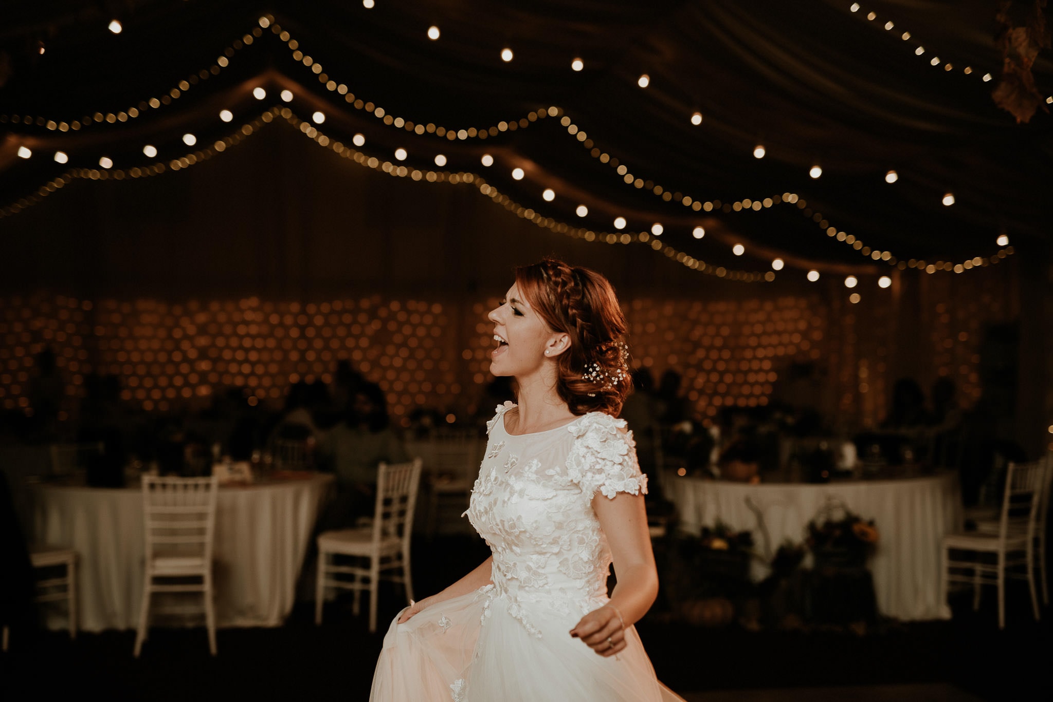 happy bride dancing on her own