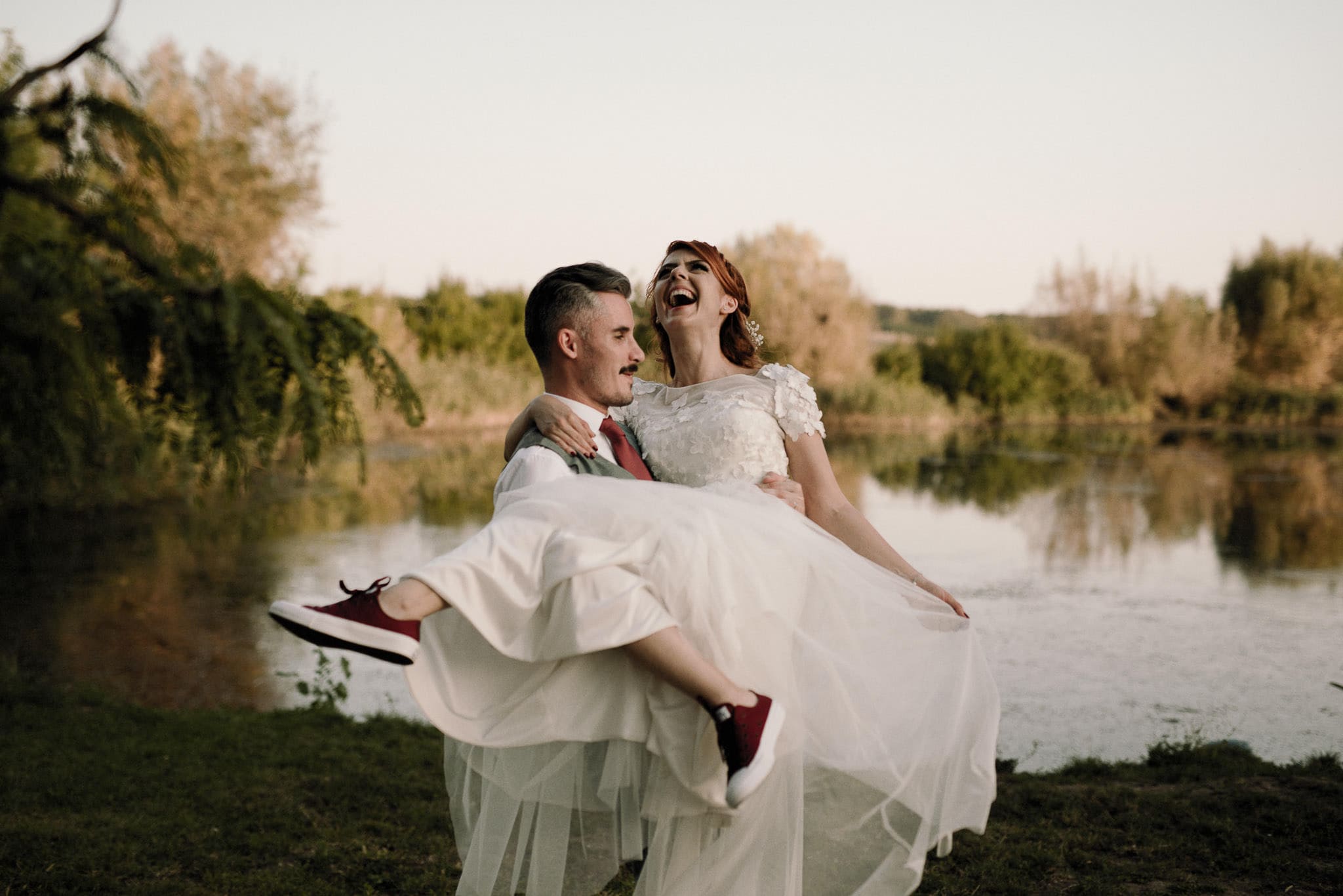 newlyweds having fun after their autumn wedding ceremony