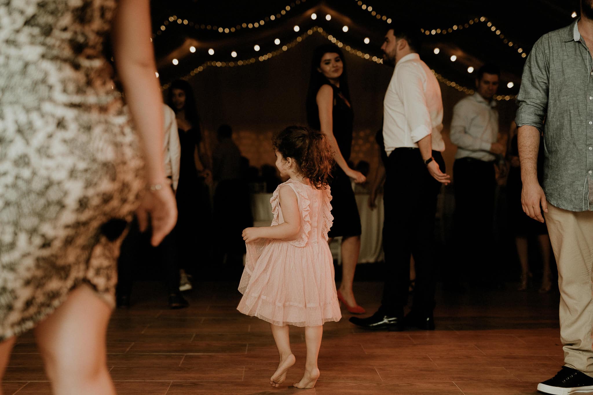 girl dancing barefoot on the dance floor