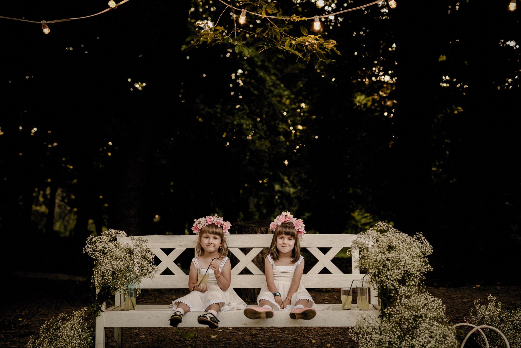 flower girls enjoying the outdoor wedding decor