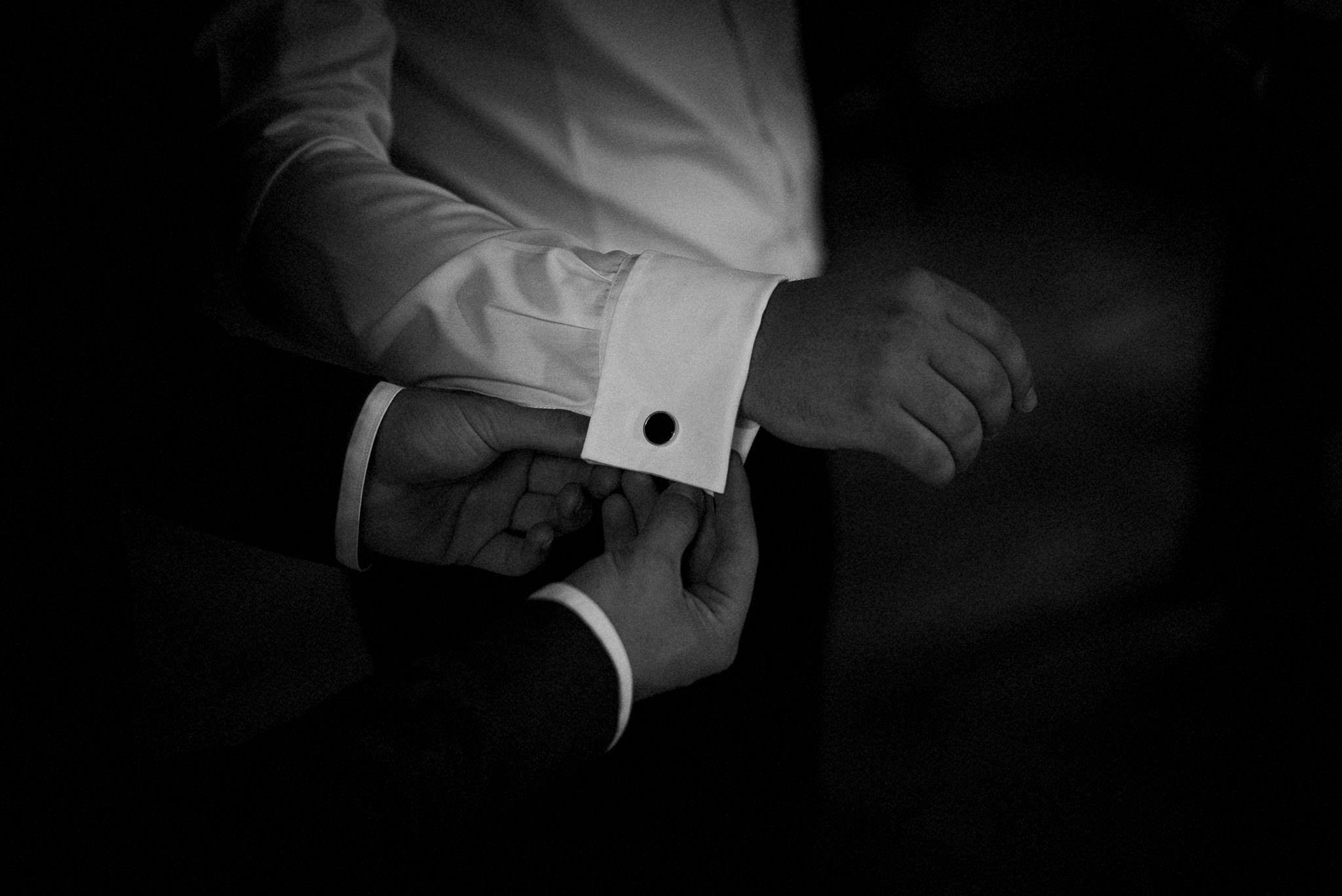 detail of groom's cufflinks