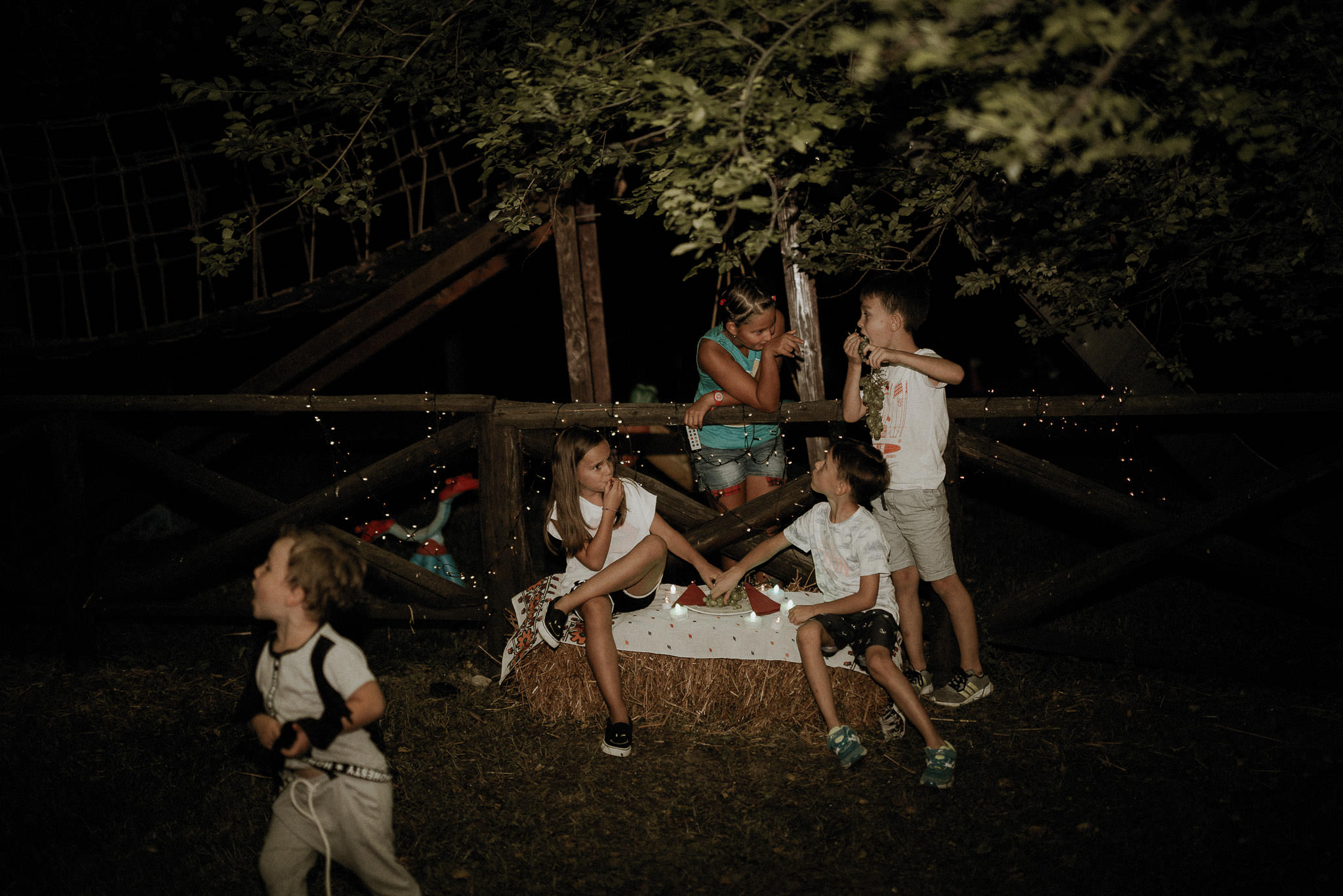 kids having fun during wedding night party in the forest