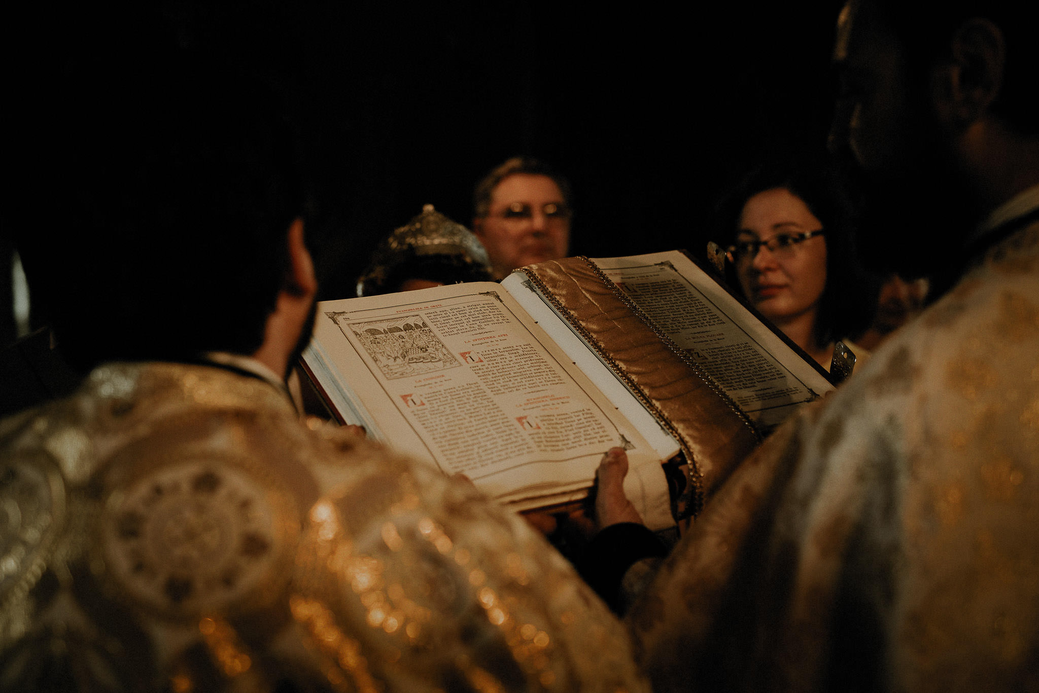 priests reading the bible during the religious ceremony