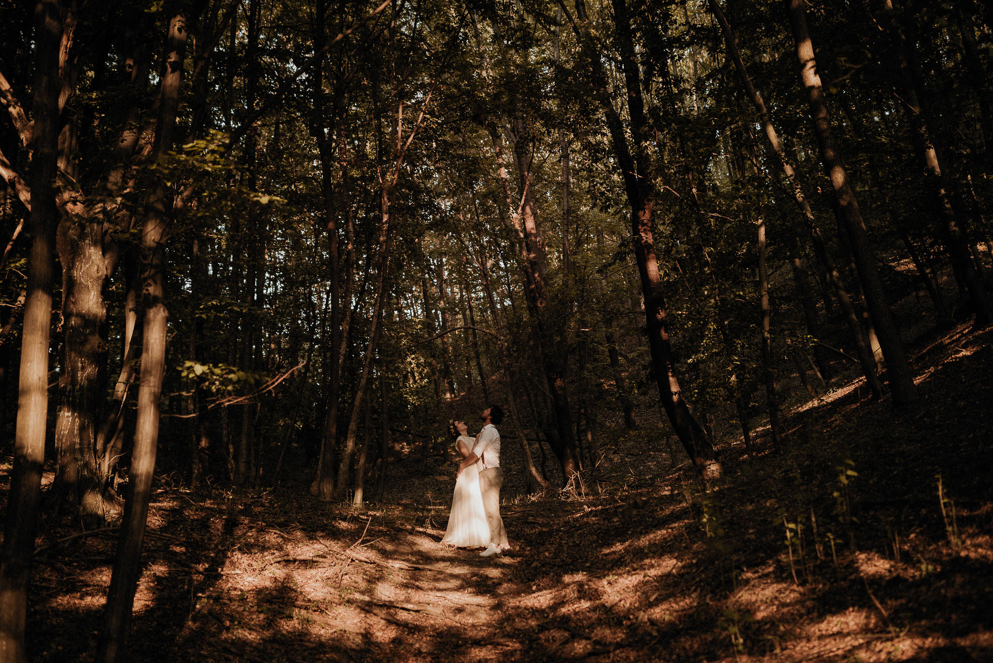 bride and groom surrounded by the forest