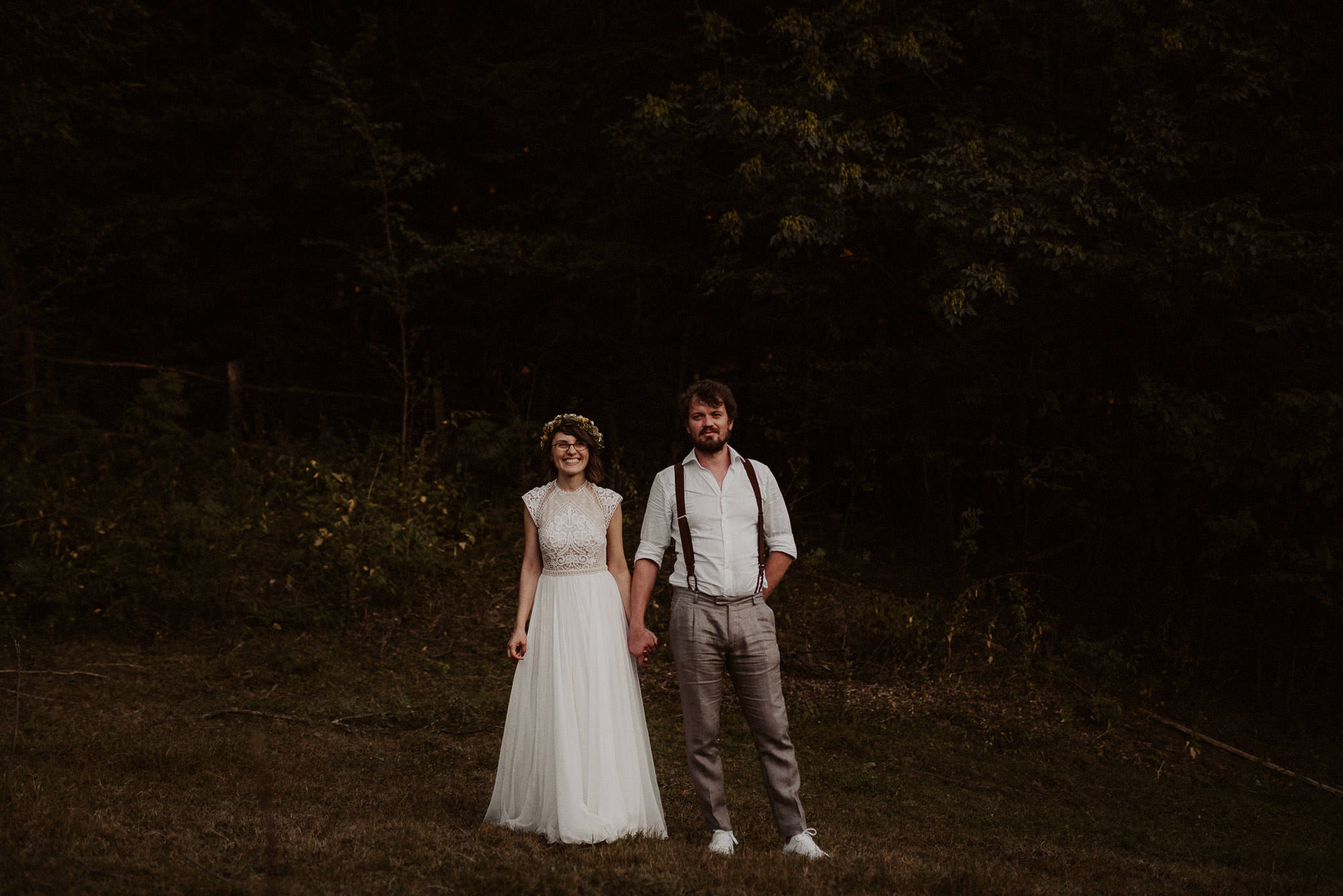 wedding couple during their traditional rustic wedding in a forest