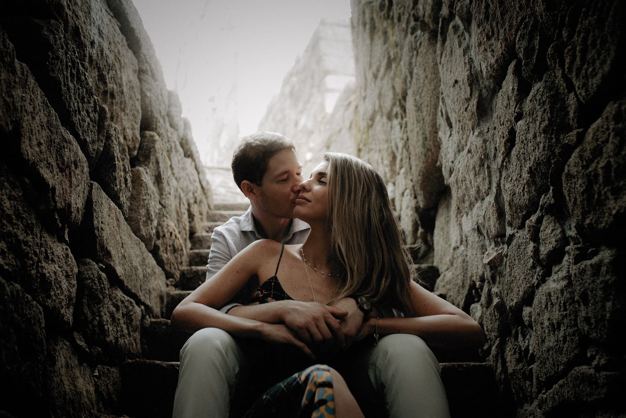 Couple kissing on the steps in Jardim das Virtudes in Porto