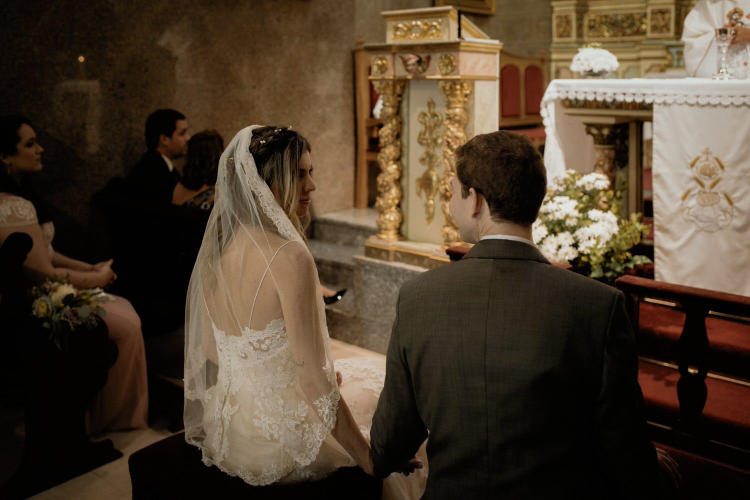bride sharing an intimate moment after getting married in church in Portugal