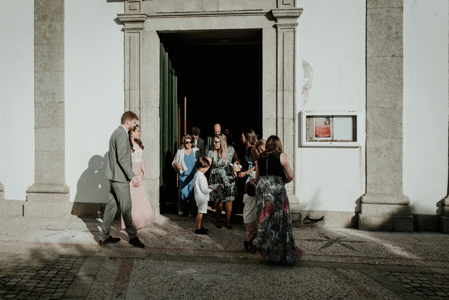 wedding guests getting out of the church