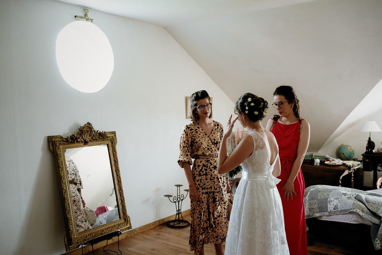 Charming Destination Wedding in the Portuguese Countryside - bride and her bridesmaids sharing an emotional moment during the morning preparations