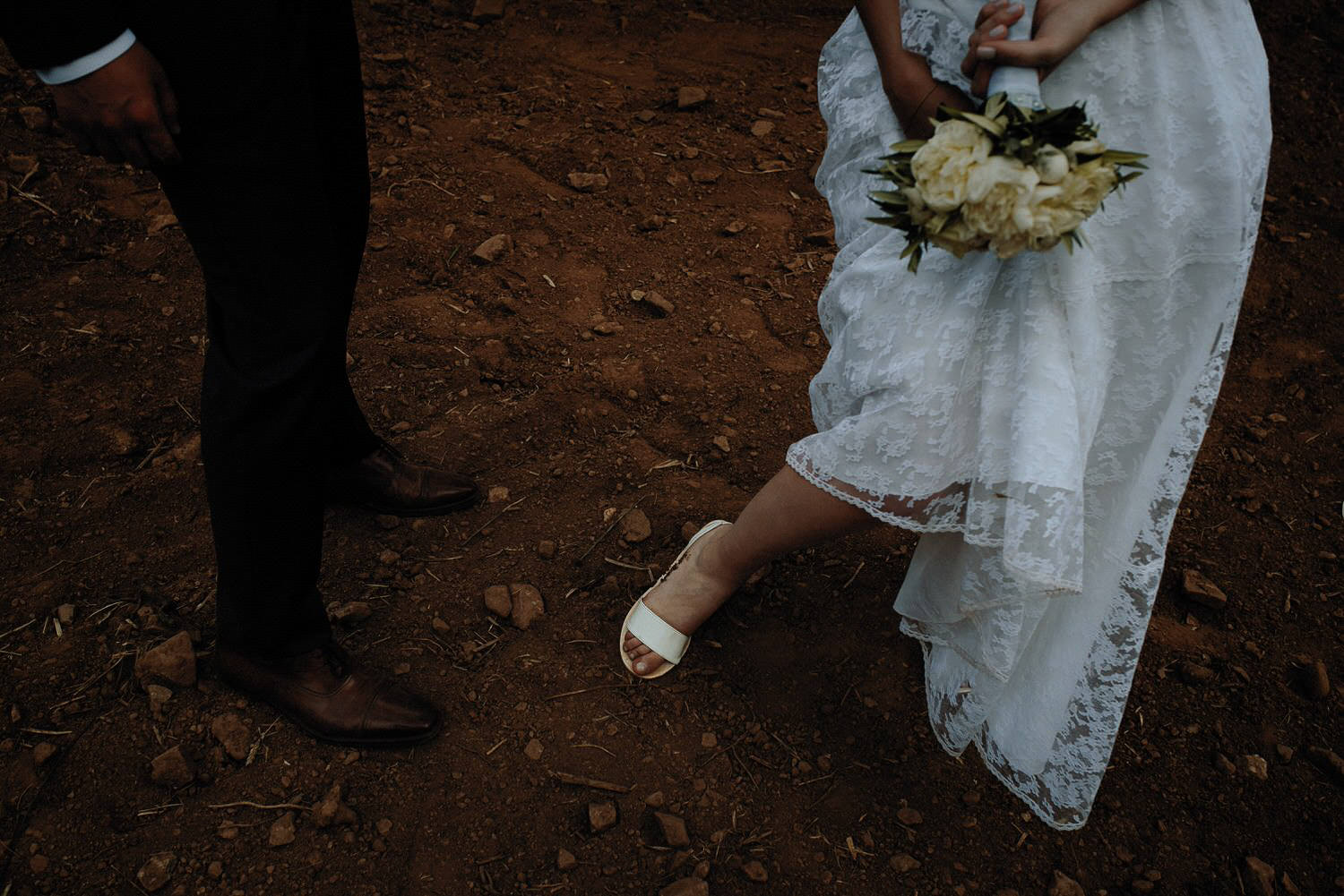 Charming Destination Wedding in the Portuguese Countryside - bride and groom getting dirty during their photosession