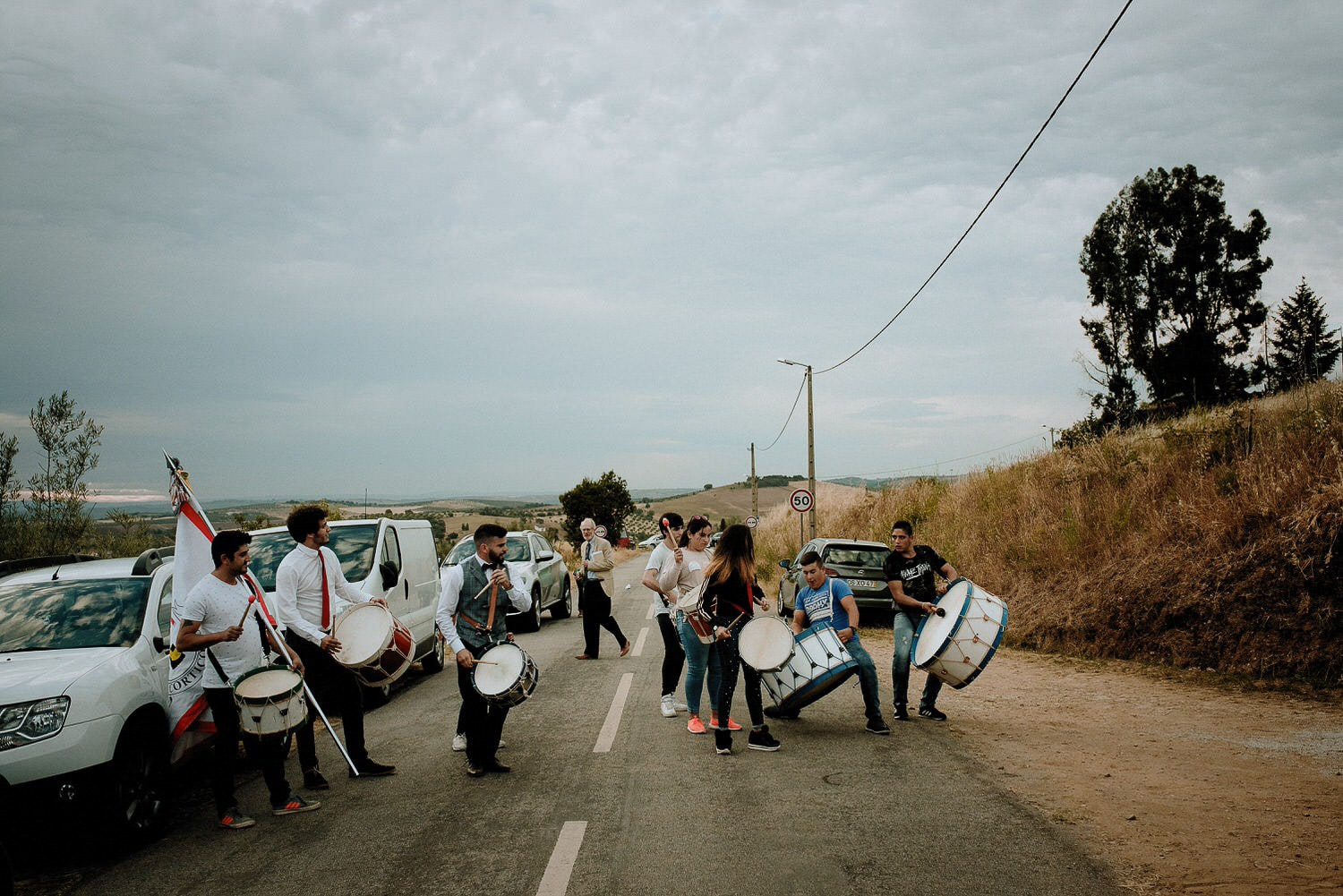 Charming Destination Wedding in the Portuguese Countryside - local village band playing on the drums in the middle of the road