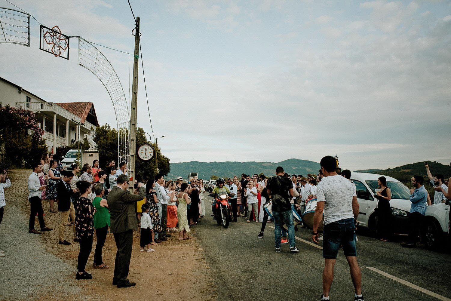 Charming Destination Wedding in the Portuguese Countryside - wedding guests enjoying the music of the local village band playing on drums