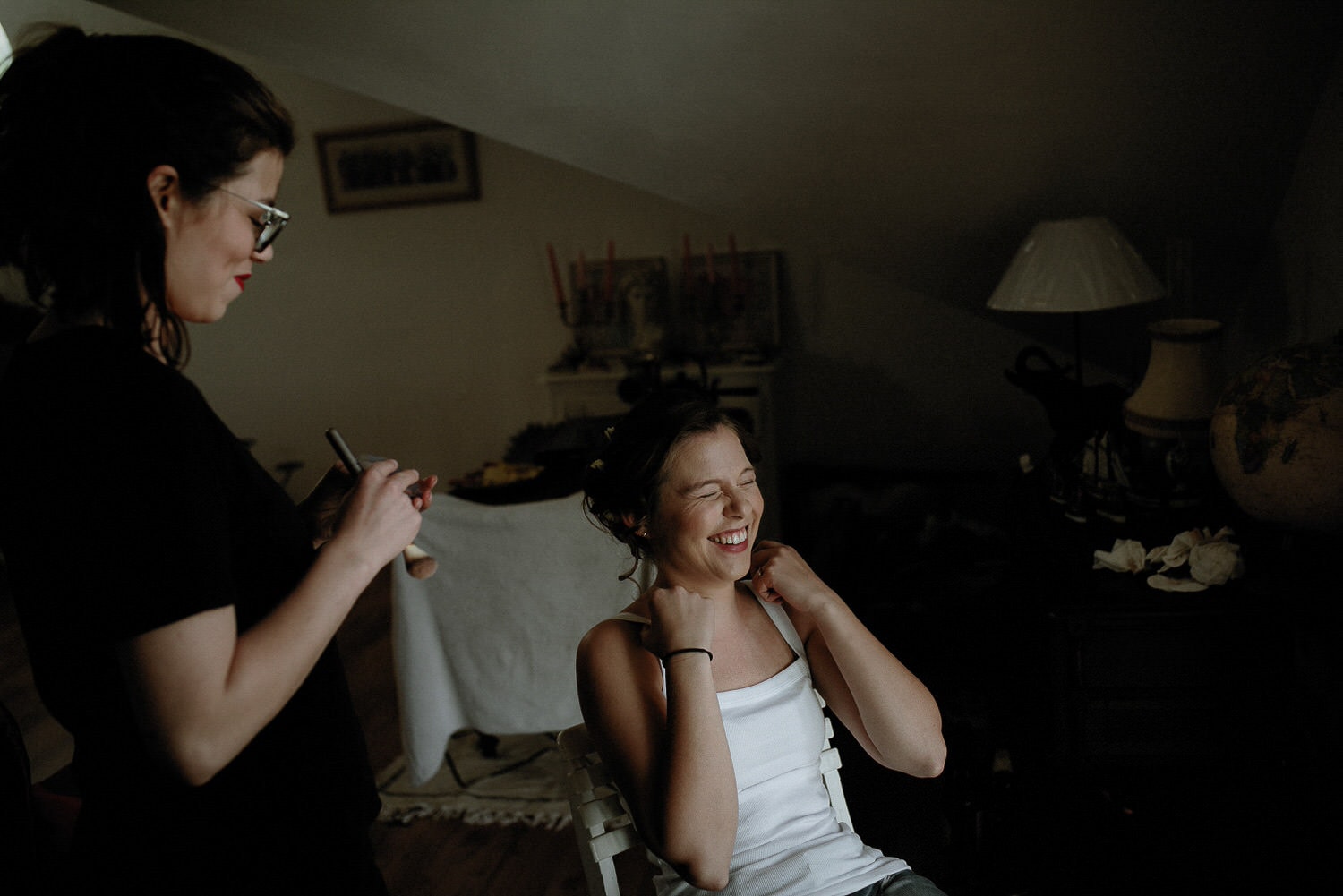 Charming Destination Wedding in the Portuguese Countryside - bride getting ready for the makeup in front of the window