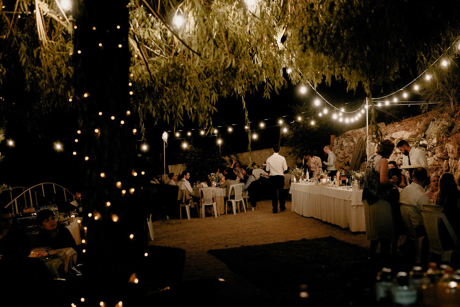 Charming Destination Wedding in the Portuguese Countryside - night time decorations with fairy lights and candles